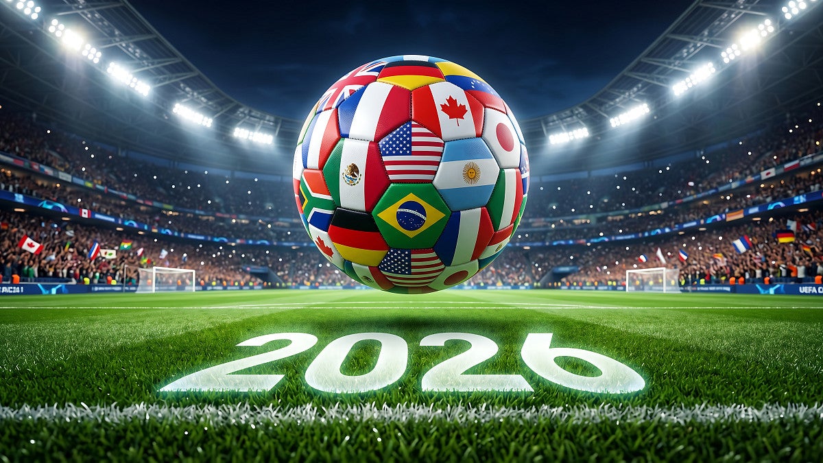 World Cup soccer ball with country flags hovers above a field