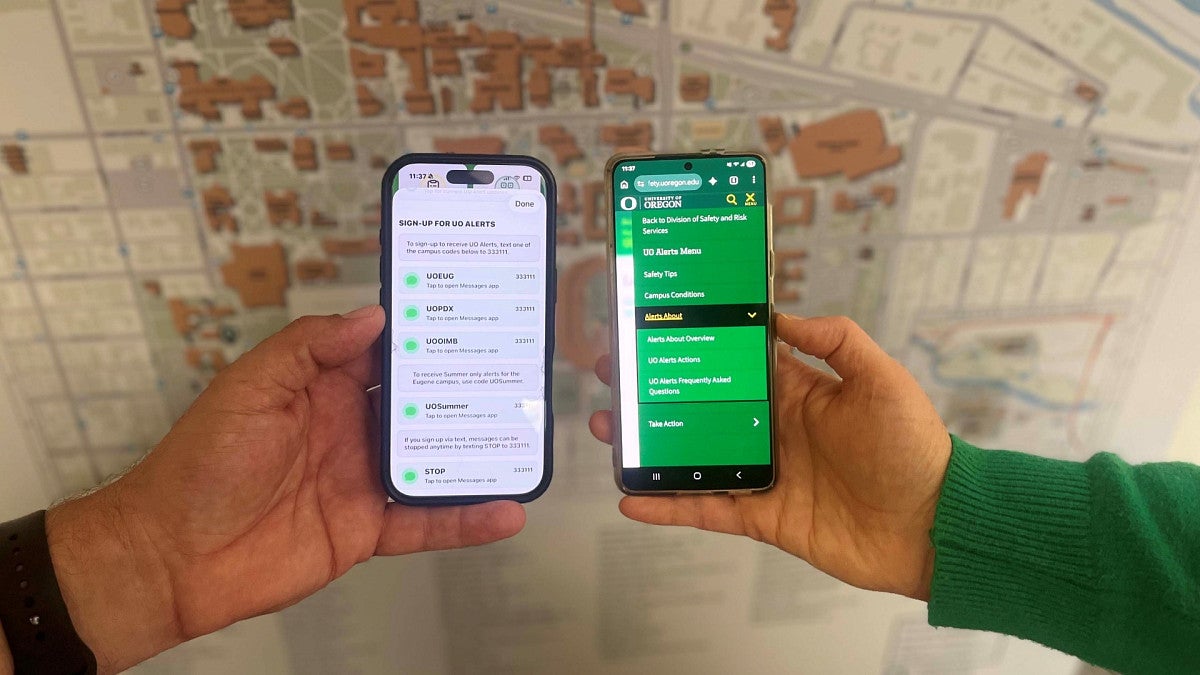 two cellphones showing UO Alerts