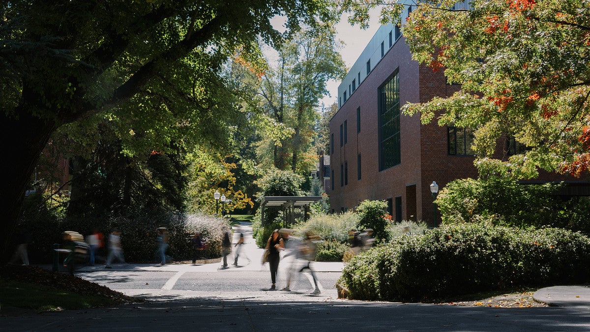 people walking through campus