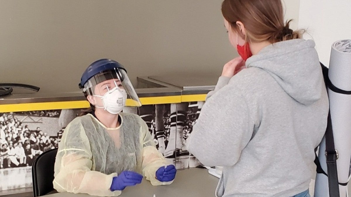 Two people at a COVID testing center