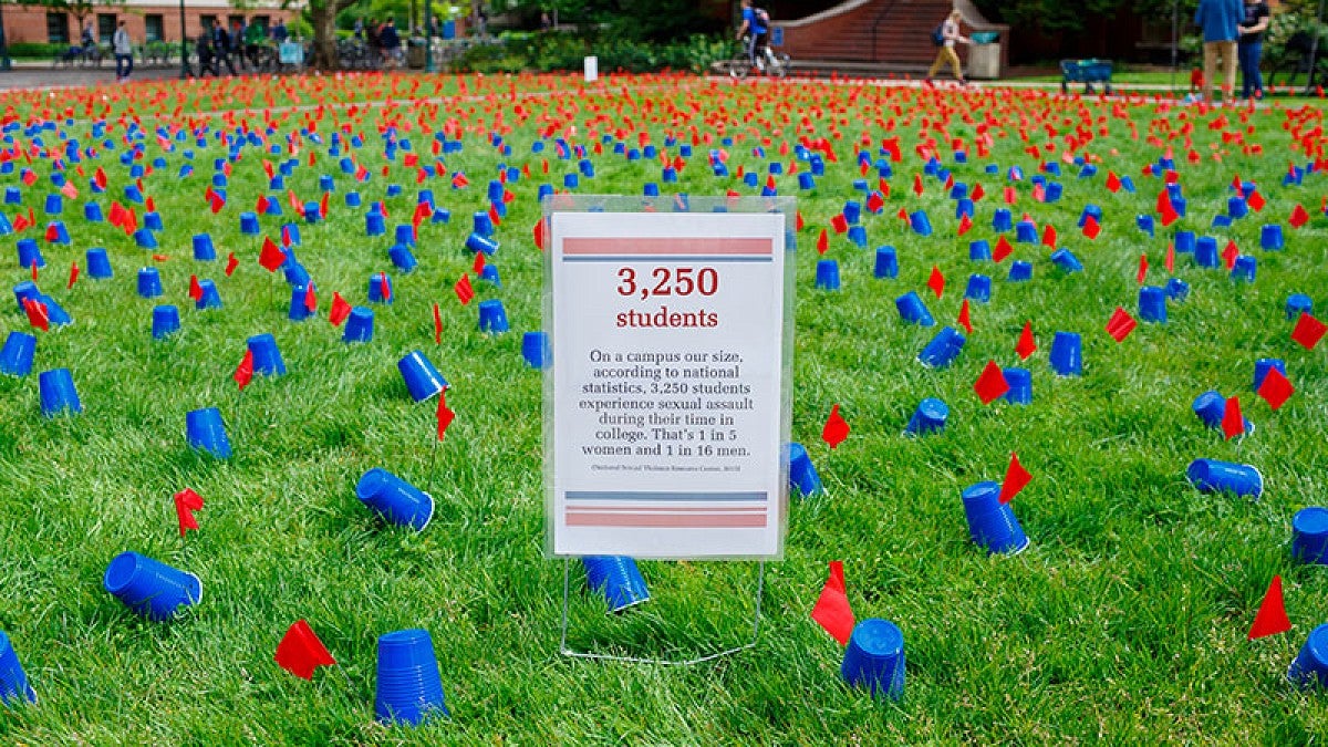 Image shows a scene from a 2016 Sexual Assault Awareness Month demonstration on the UO campus