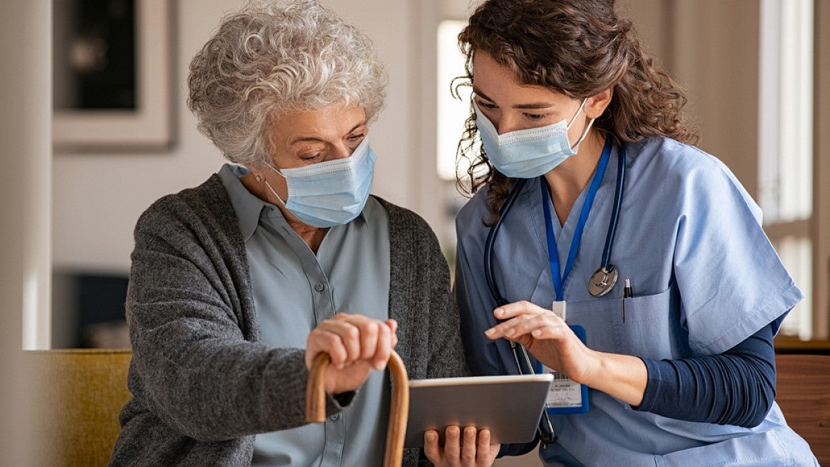 Doctor with older patient