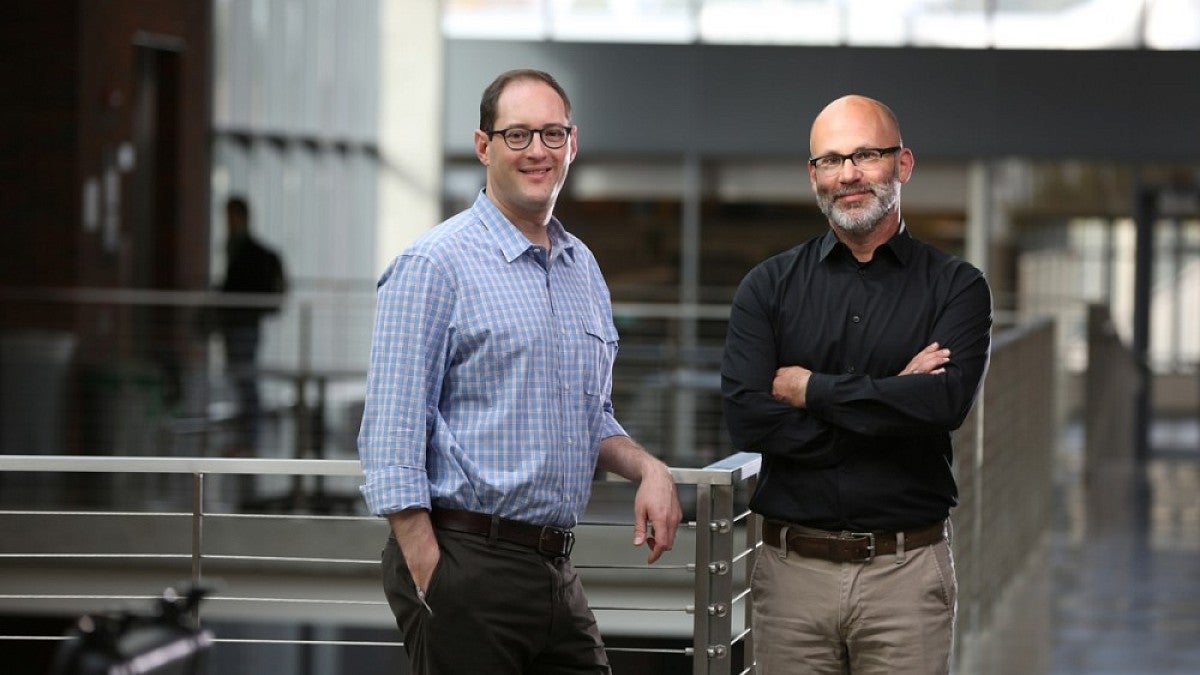 Elliot Berkman, left, and Phil Fisher