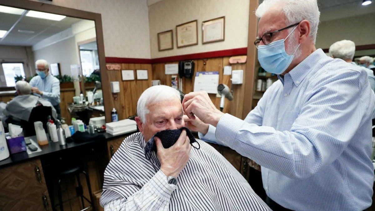Barber cutting a man's hair