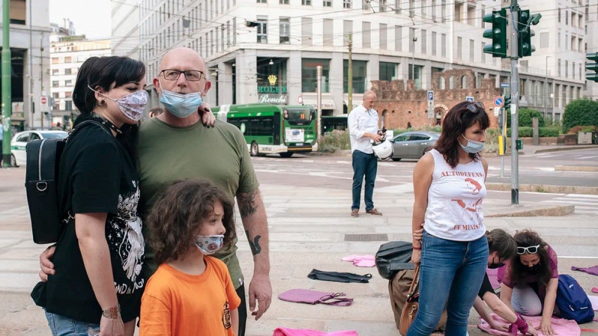 A family poses after the Not One Less protest