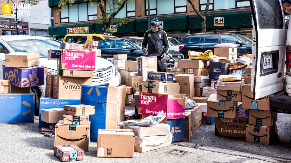 Delivery boxes stacked on sidewalk