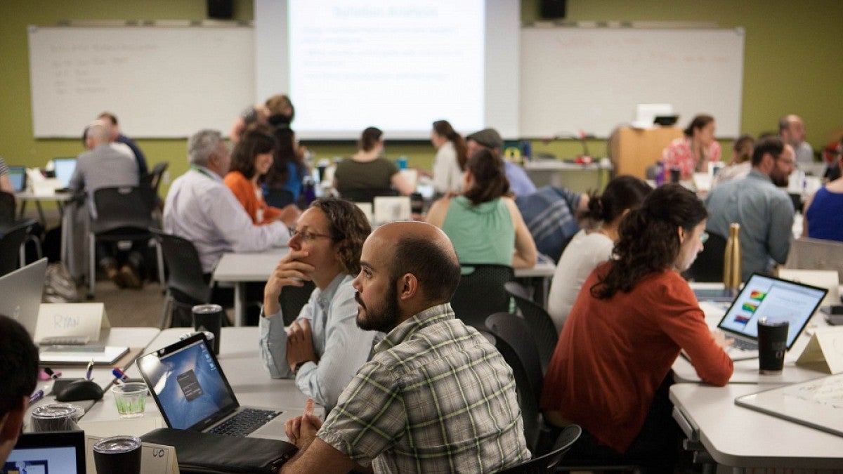 Participants at the 2017 Northwest Regional Summer Institute on Scientific Teaching at the University of Oregon discuss how to support improved student learning outcomes in the sciences and make other improvements to STEM education. Photo courtesy of Dan 