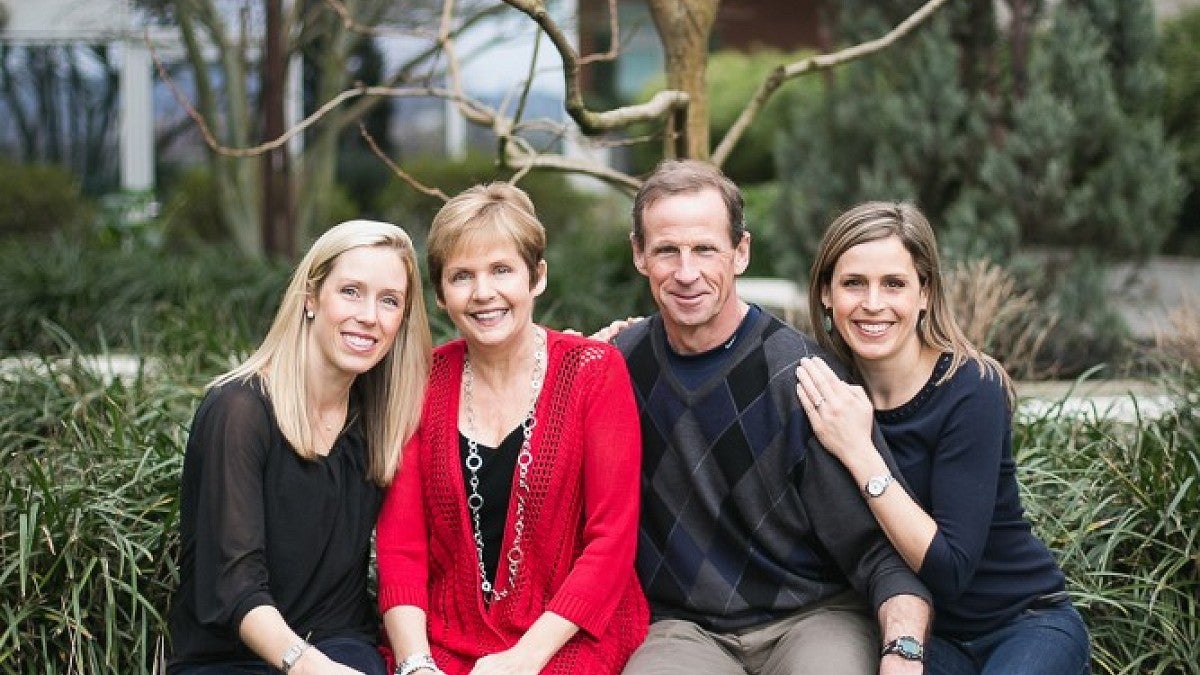 Claudia Lacey McNeil (in red) with her husband Dan and daughters, Christy MacColl and Carrie Gross. A scholarship fund is being established in McNeil's name by her friend, Gretchen Anderson Pilip.