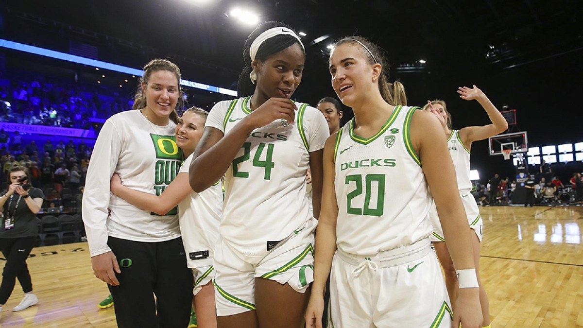 Ruthy Hebard and Sabrina Ionescu with teammates