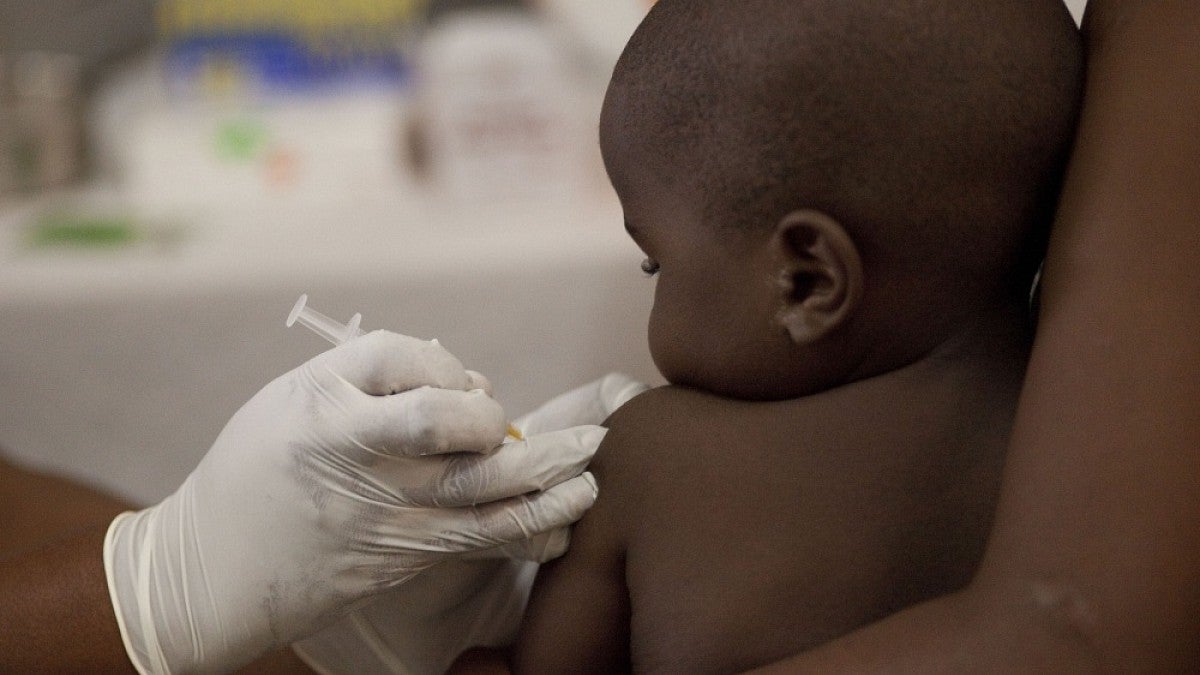 An infant receiving an injection