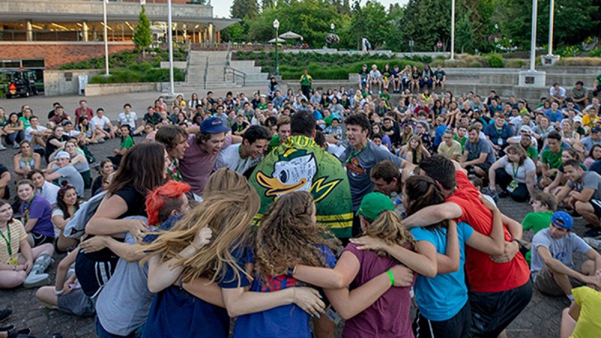 Incoming students in a huddle