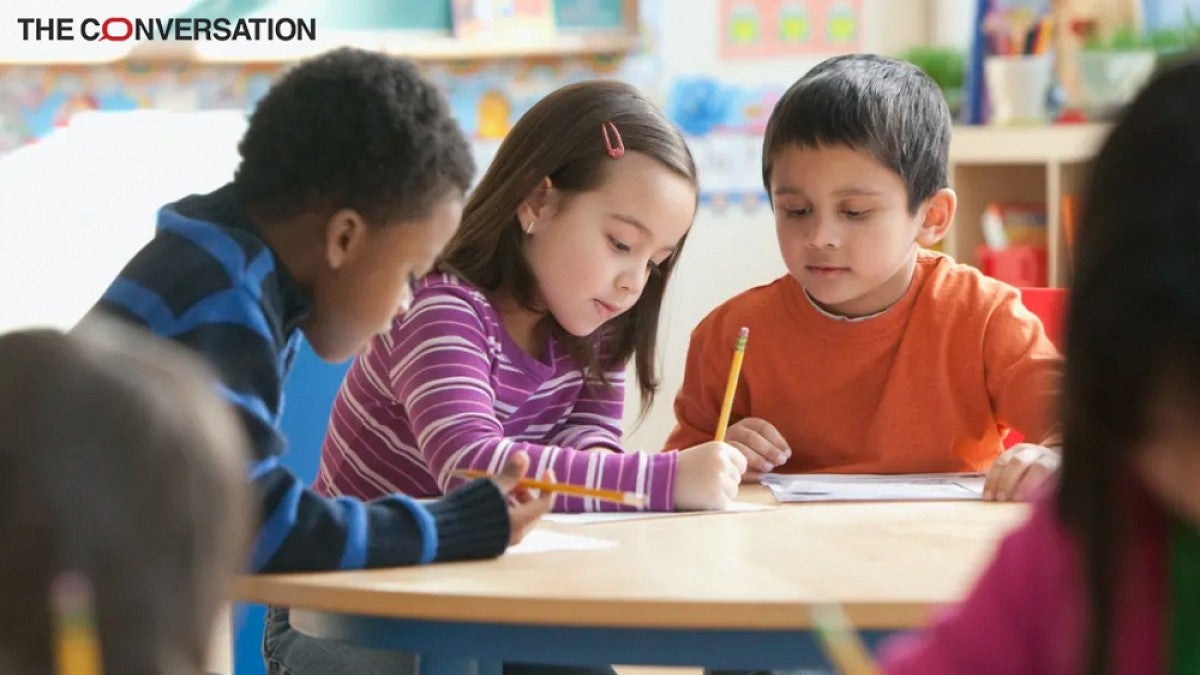 Children studying at table