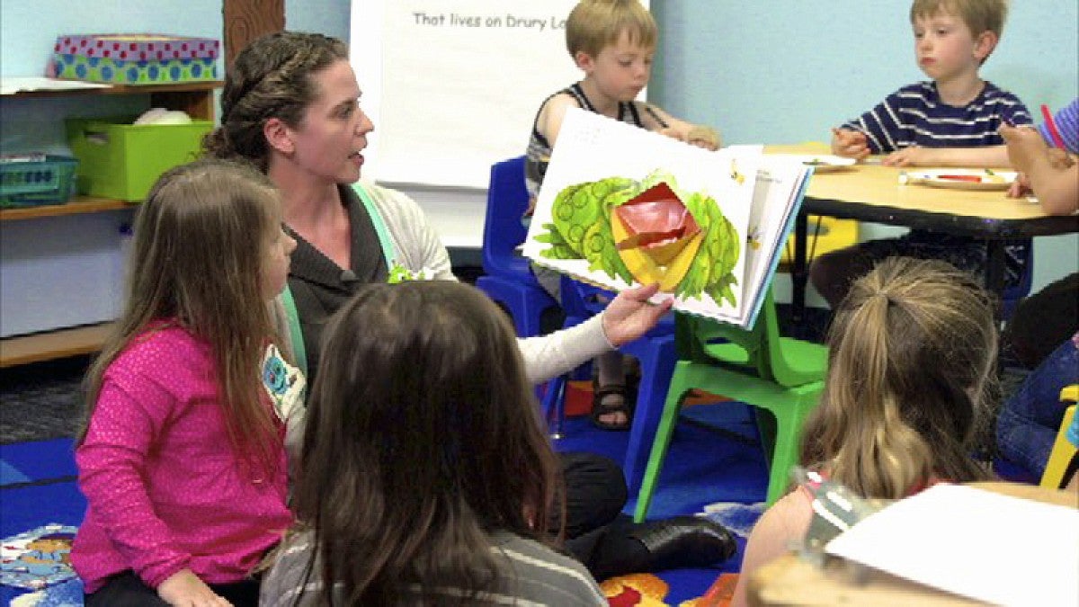 Teacher works with students in the Kids in Transition to School program