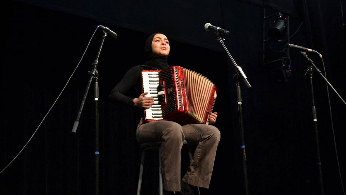 Mayra Elide performs at the 2017 International Womxn's Day Celebration