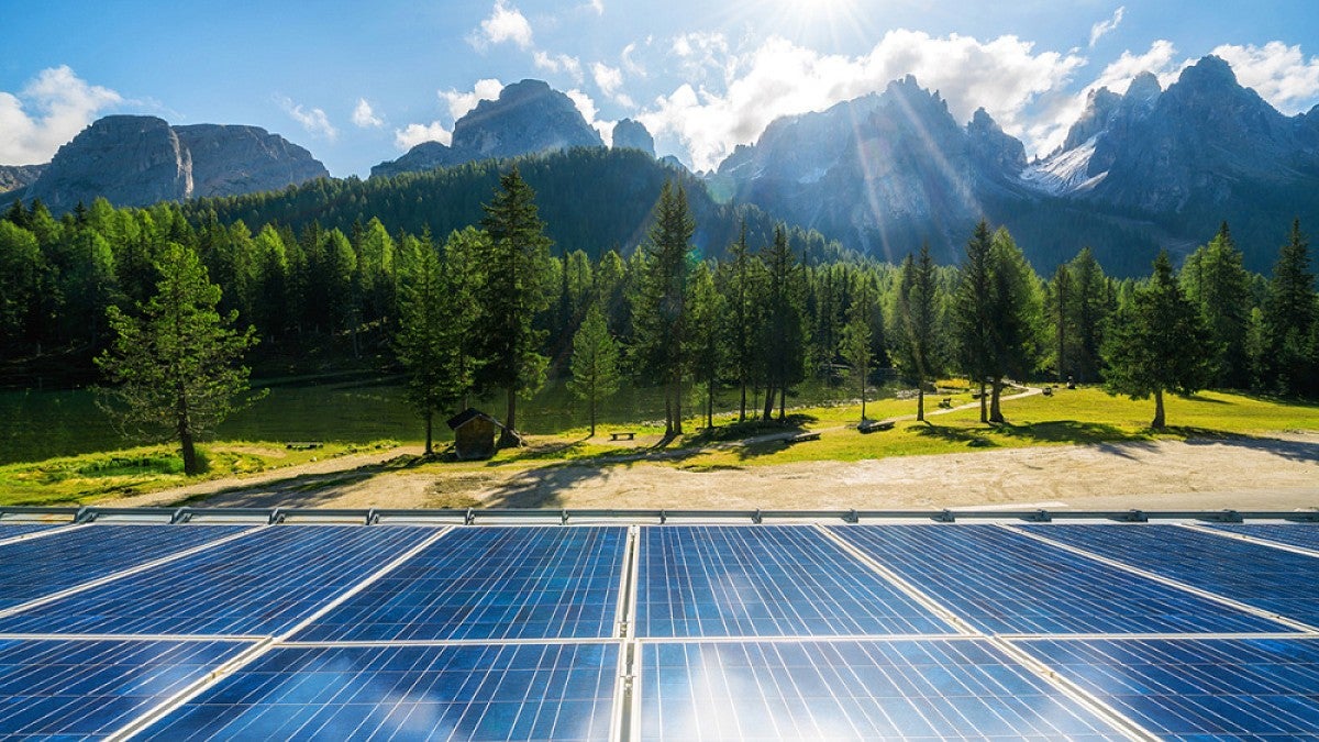 Solar panels with mountains in distance