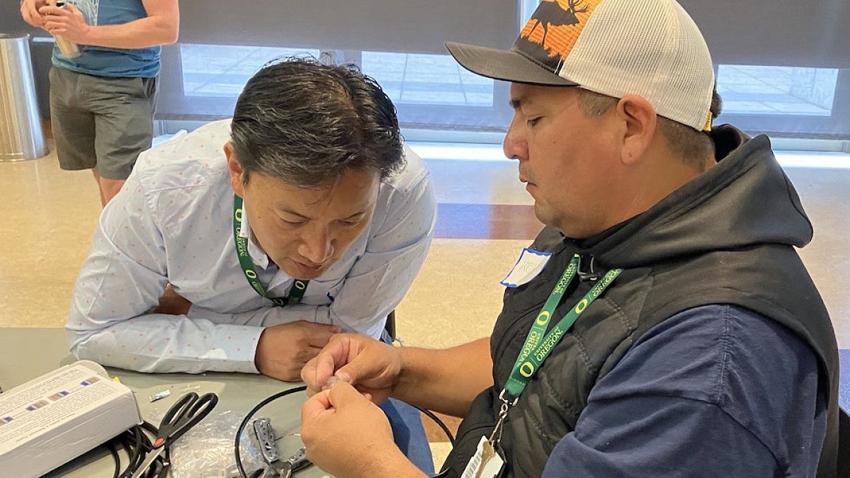 Tribal member working on computer wiring