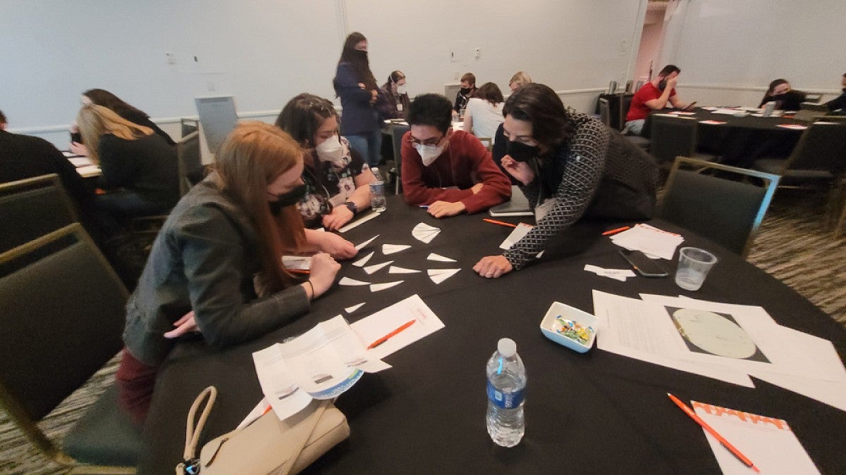 Teachers working on a tabletop exercise