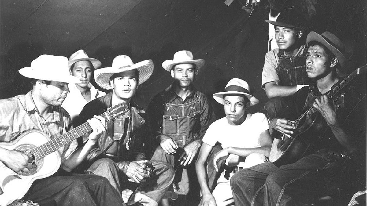 Workers playing guitars. 