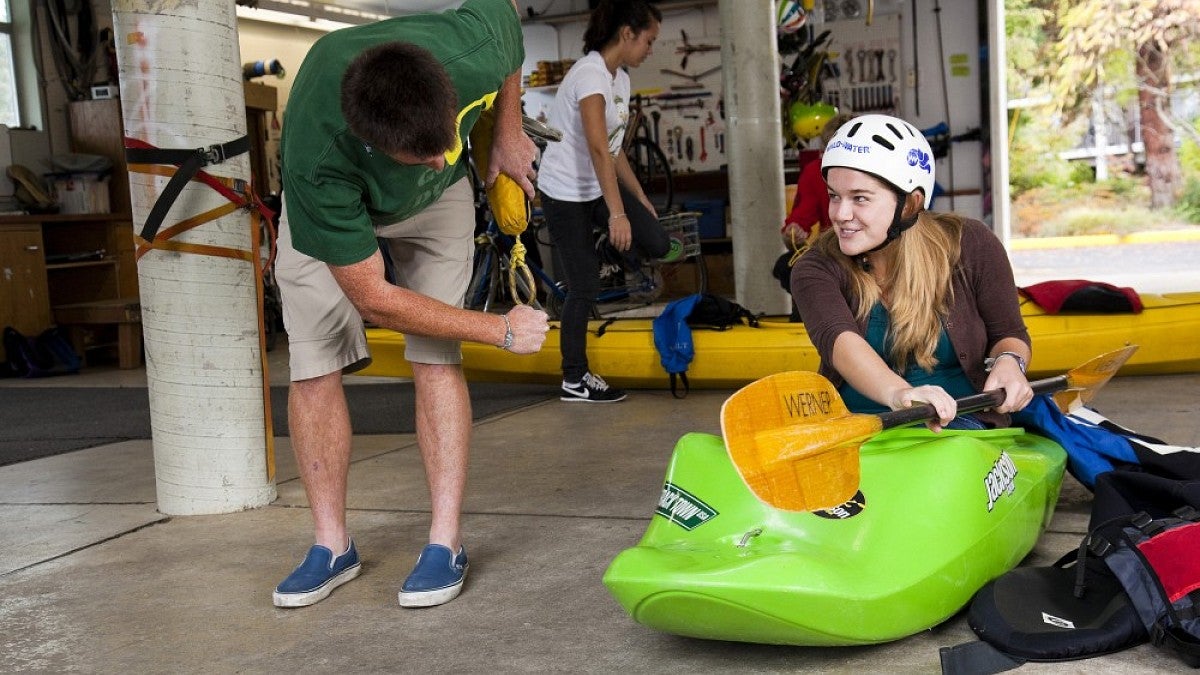 Getting outfitted for a kayak trip at the Outdoor Program Barn