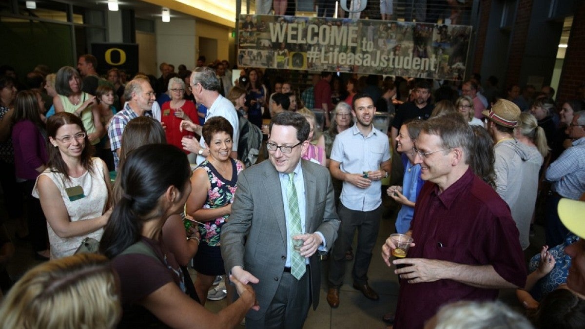 UO president Michael Schill visits with faculty, staff and students at a reception on Monday, July 6, at Allen Hall