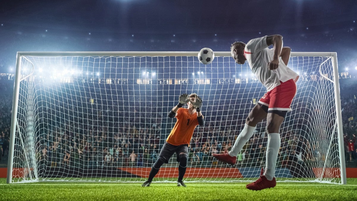 Soccer players at the net