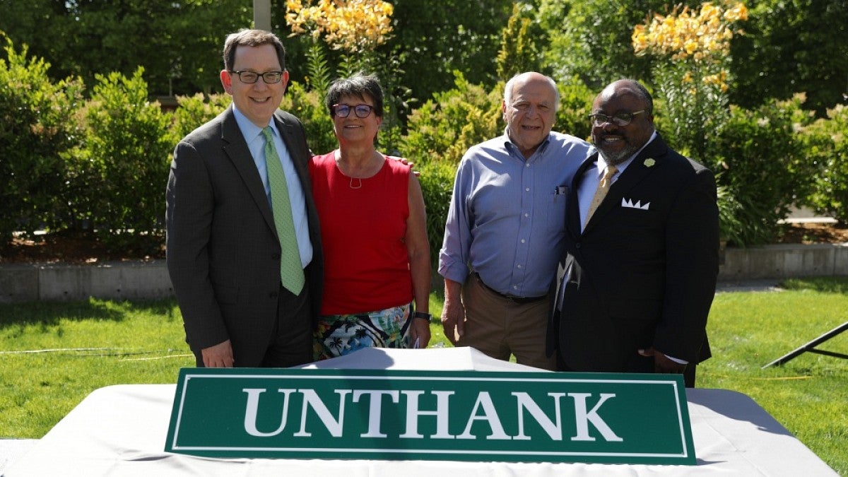 From left: UO President Michael Schill, Libby Unthank Tower (DeNorval Unthank's daughter), Otto Poticha and Greg Evans.