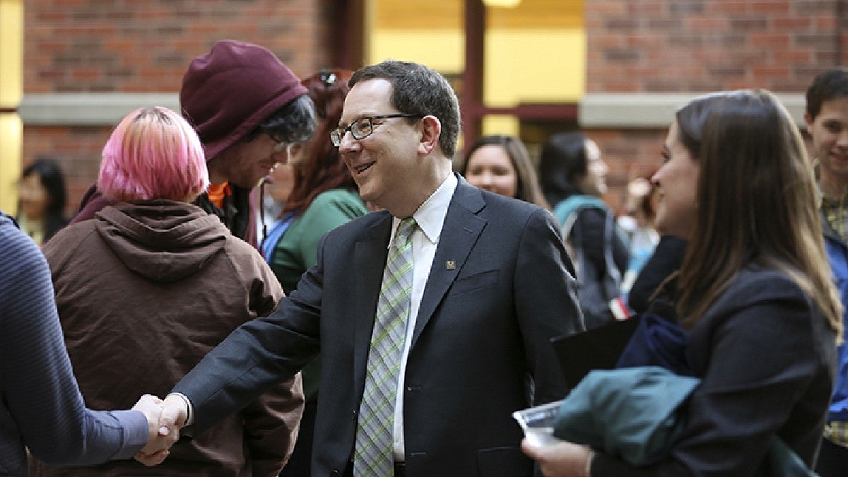 President Michael Schill greeting students