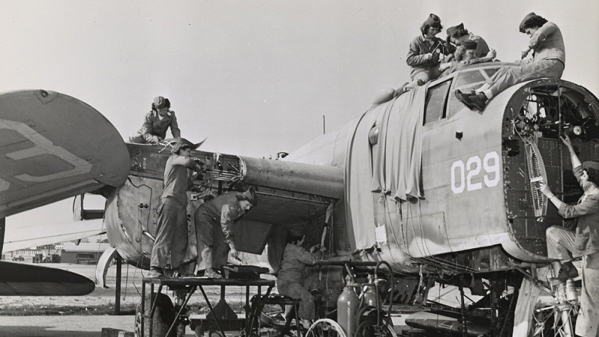 Women Marines salvage parts that can be repaired, May 1945