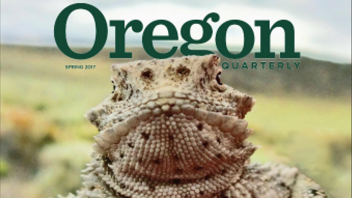 OQ Cover - Pale Yellow Lizard with the Text "Hands On"