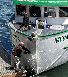 Dennis Beathma christens boat