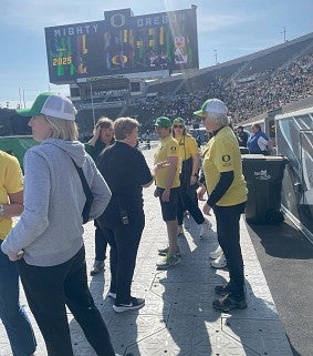 Volunteers discussing assignments at a commencement ceremony
