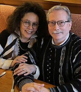 A woman and man sit together in a restaurant