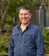 Paul Dalton outside with trees in the background