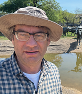 Ilya Bindeman outside with animals in the background