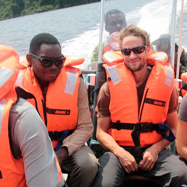 Aaron Nelson on a boat in Gabon