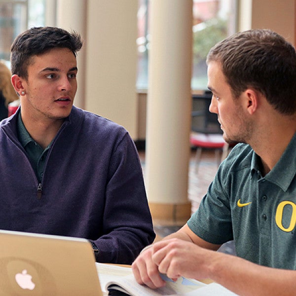 Devon Allen studying in the Lillis Business Complex