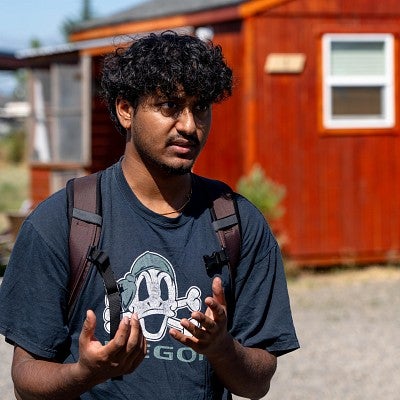 A student, Sriram Nathan, standing in the "Everyone's village" during the Bruton Design Intensive