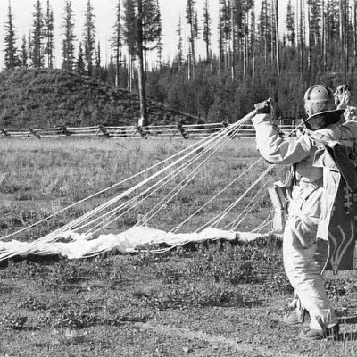 Smokejumper gathering parachute