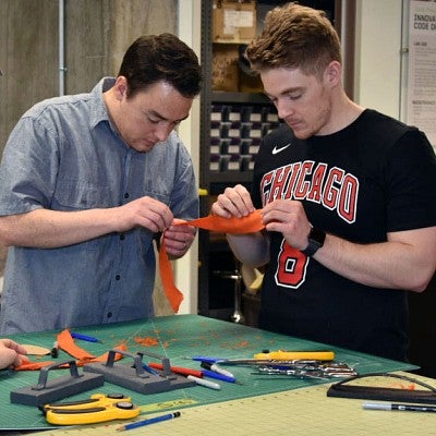 Students work on cap