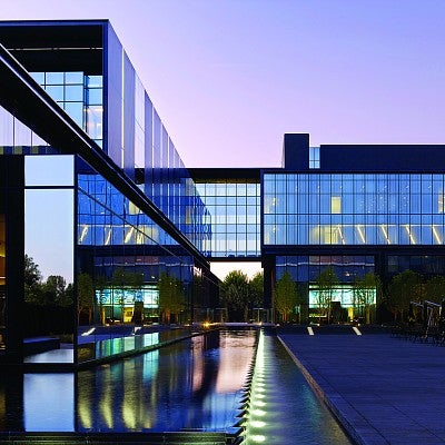 A water feature links the building to the public plaza, while sky bridges connect the different sections of the complex. Photograph courtesy ZGF Architects