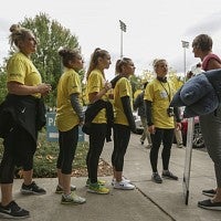 Volunteers line up for their next assignment.