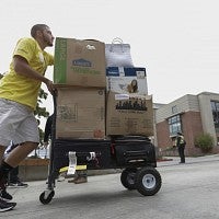 Pushing a trolley.