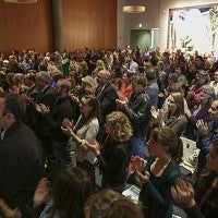 People standing and applauding