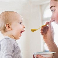 Mother feeding baby
