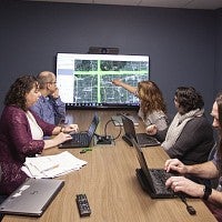 Group working in the DREAM Lab collaboration room.