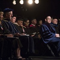 President Schill seated on stage