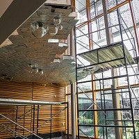 The waterfall is in the stairway leading to the underground library